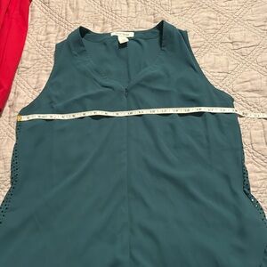 Green sleeveless blouse
